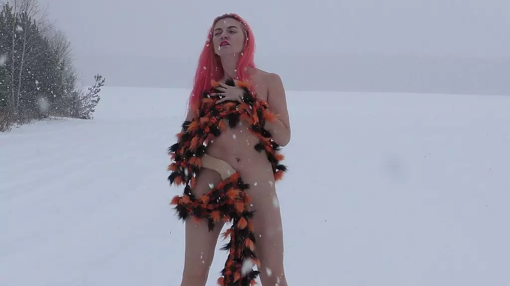snowfall in a field and a naked girl