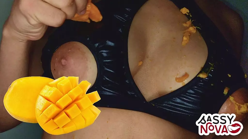sexy girl playing with mango