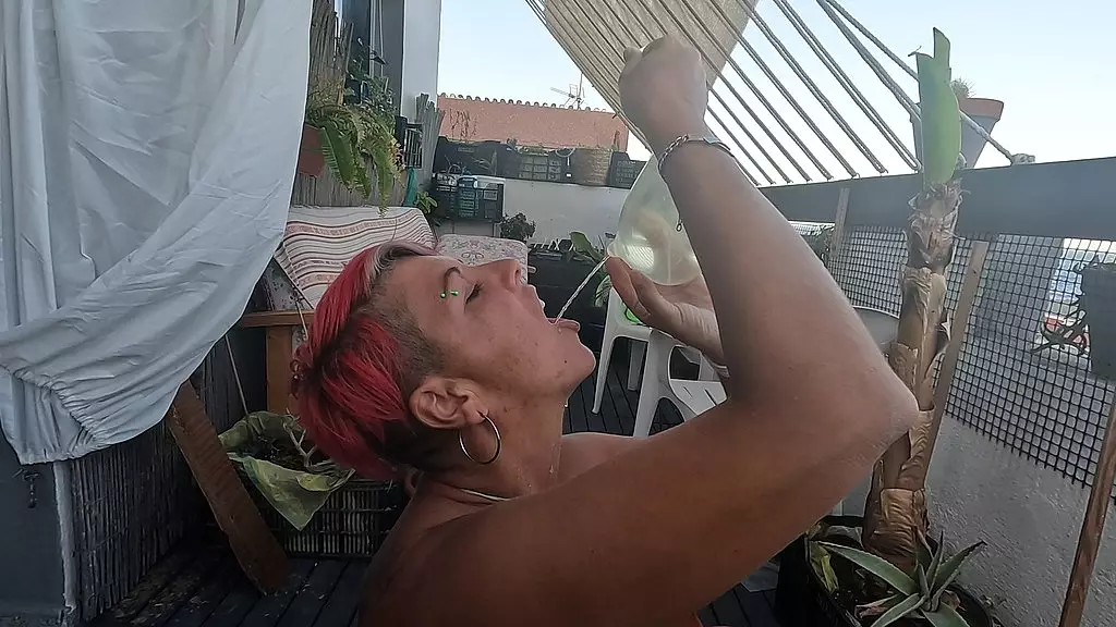drinking cum & piss cocktail from a condom
