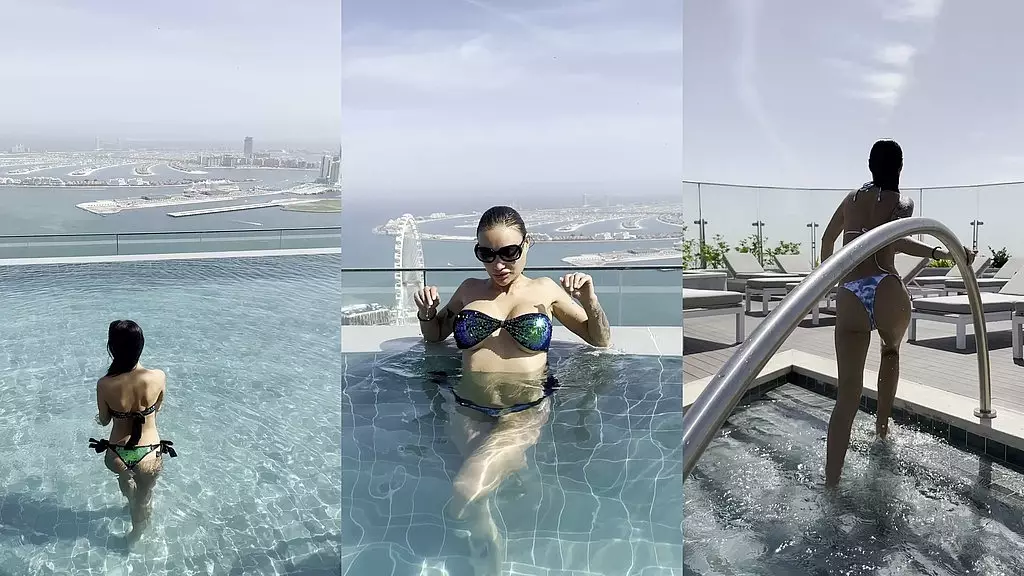monika fox poses in bikini & swims in pool on roof of hotel