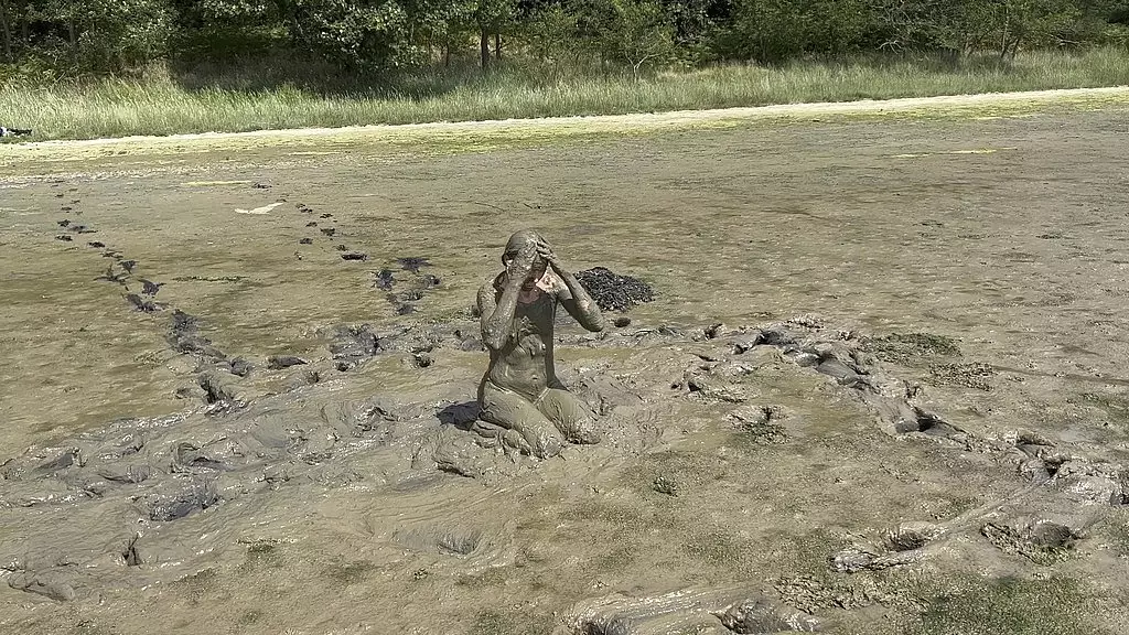 mud girl playing in the nude