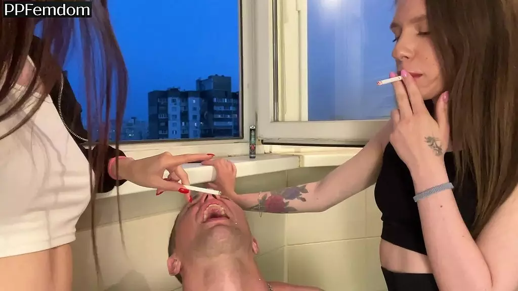 two bitchy girls smoke and humiliate a guy using his mouth as an ashtray