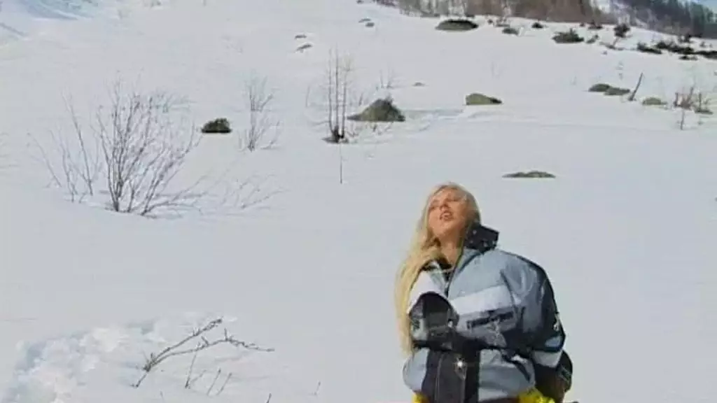 sharon bright is on a snowy mountain giving a ski instructor a blowjob